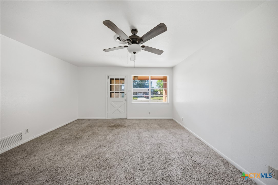 1311 Missouri Avenue Killeen, TX 76541 - Photo 9 of 29 an empty room with windows and fan