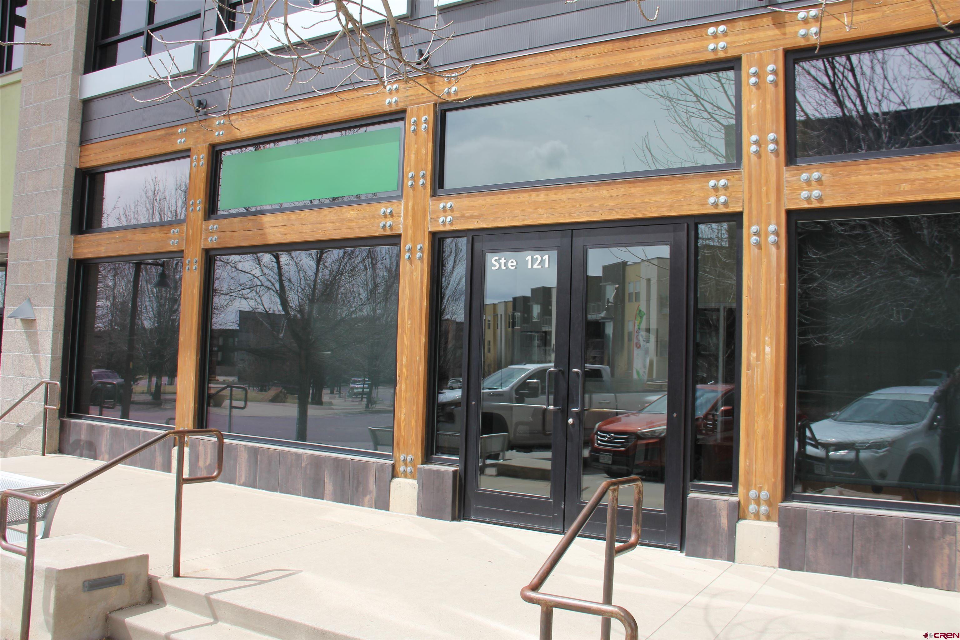 175 Mercado Street, Unit 121 Durango, CO 81301 - Photo 1 of 18 a dining room with a glass door and glass door