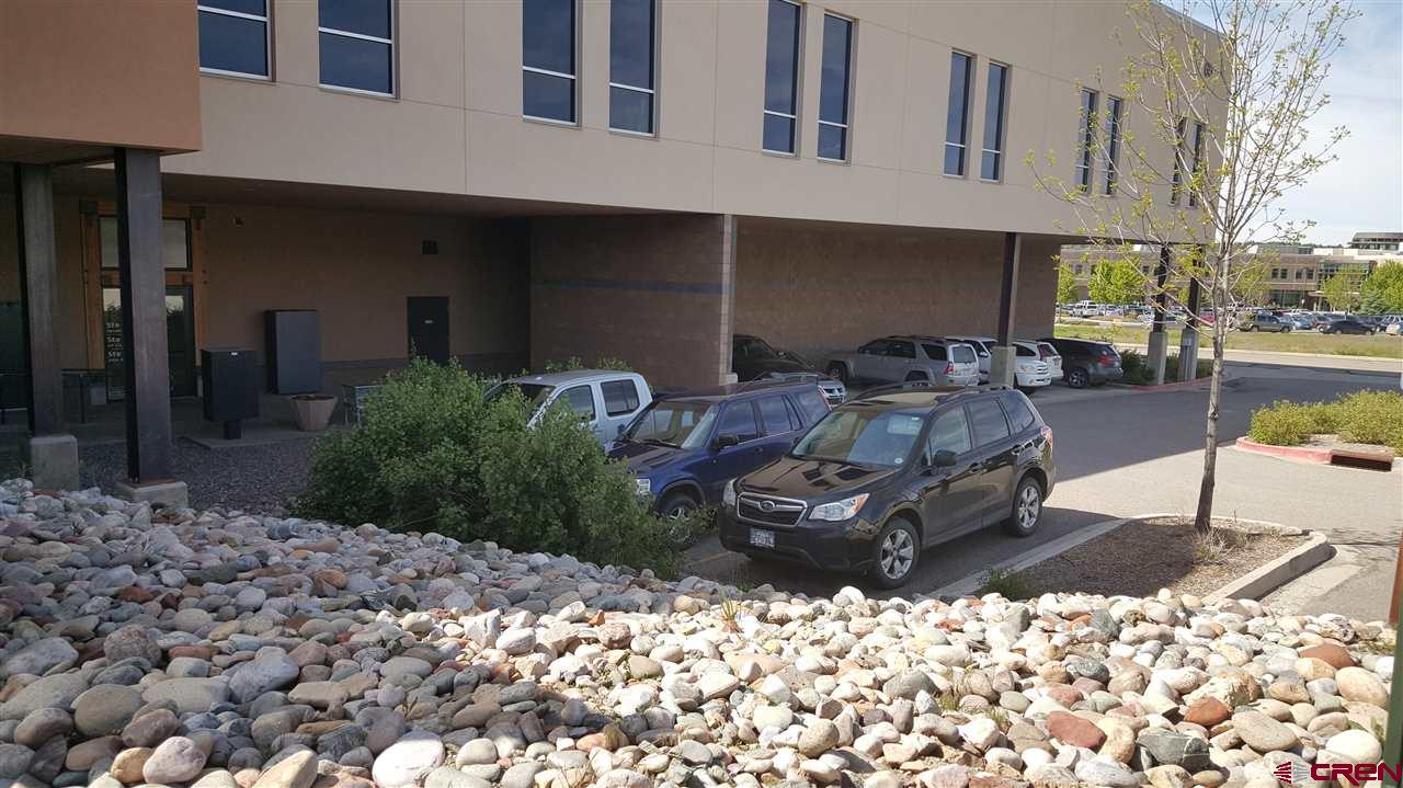 175 Mercado Street, Unit 121 Durango, CO 81301 - Photo 16 of 18 a view of a chairs and table in backyard