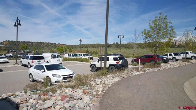 a roof deck with table and chairs