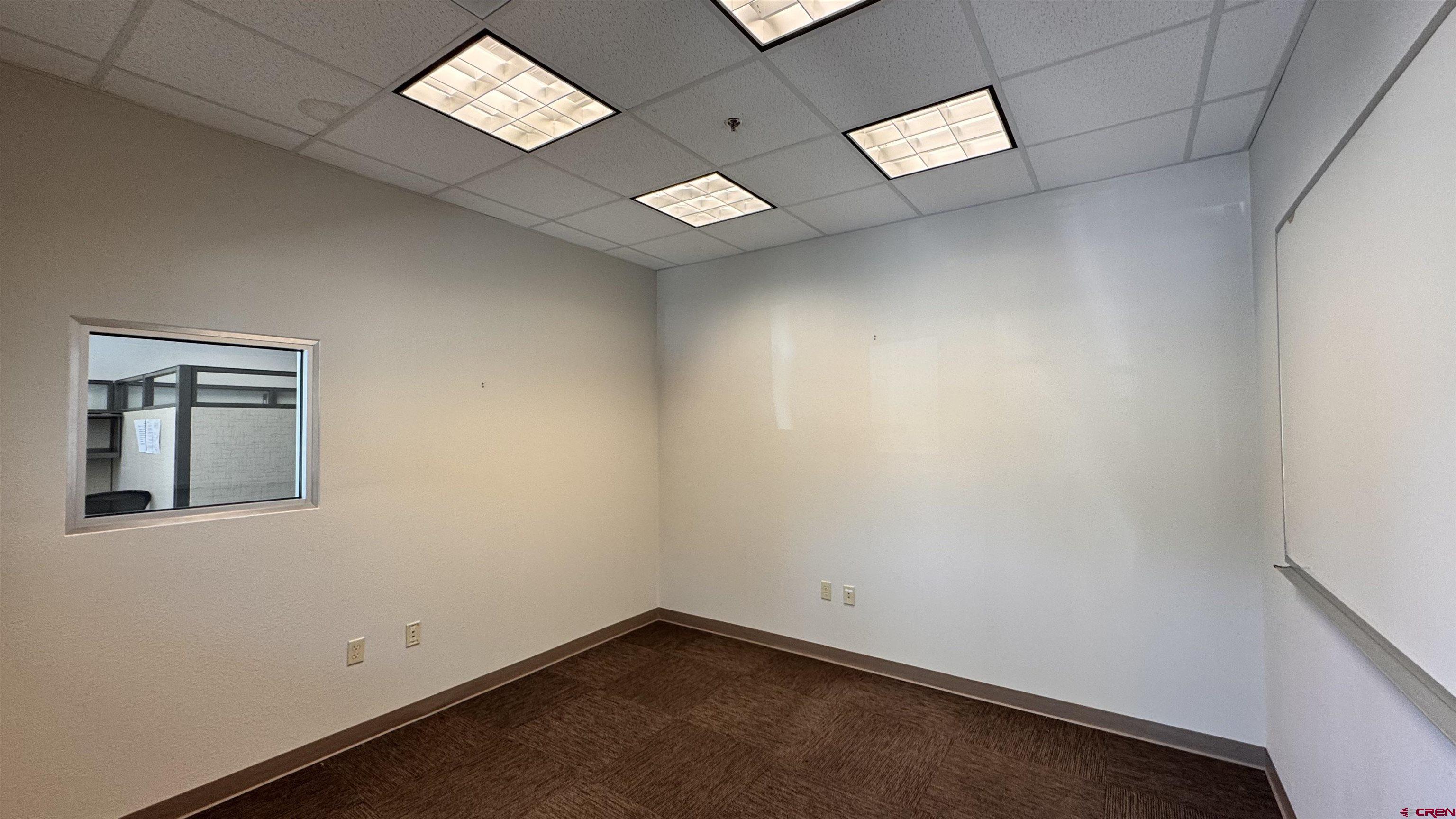 175 Mercado Street, Unit 121 Durango, CO 81301 - Photo 6 of 18 an empty room with a window