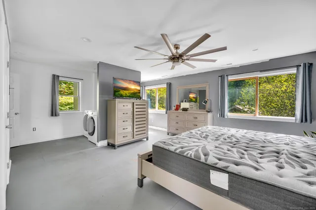 a living room with natural light and a window