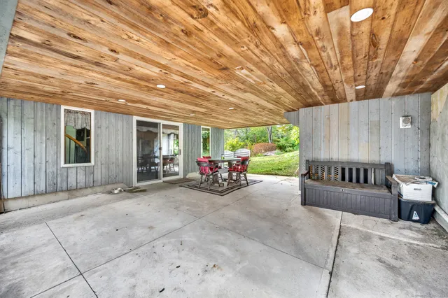 a view of a chairs and table in a patio