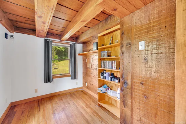 a view of a room with a barbeque and wooden floor