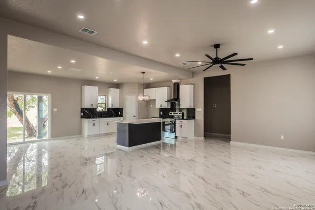a view of kitchen with refrigerator and window