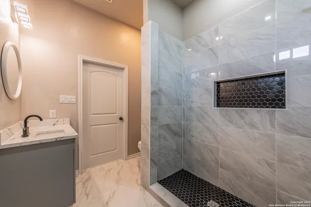 a bathroom with a sink and a mirror
