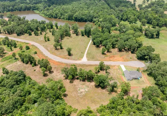 an aerial view of residential house with outdoor space