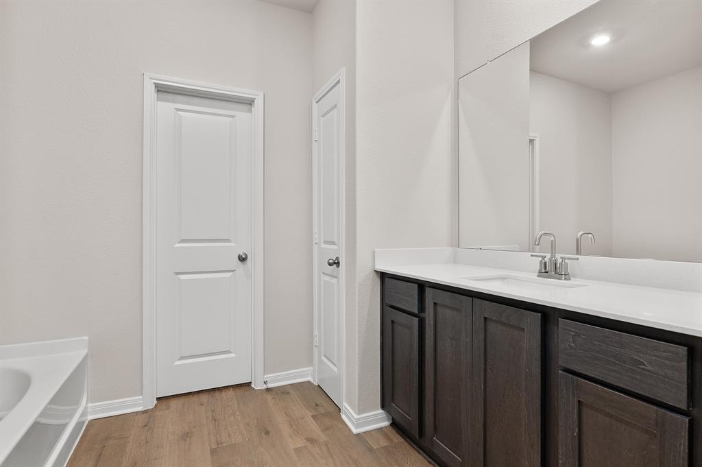 209 Southgate Drive Terrell, TX 75160 - Photo 5 of 5 a bathroom with a sink and a mirror