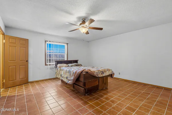 a bedroom with a bed and a shower