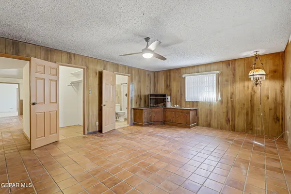 a view of a kitchen with a sink and a refrigerator