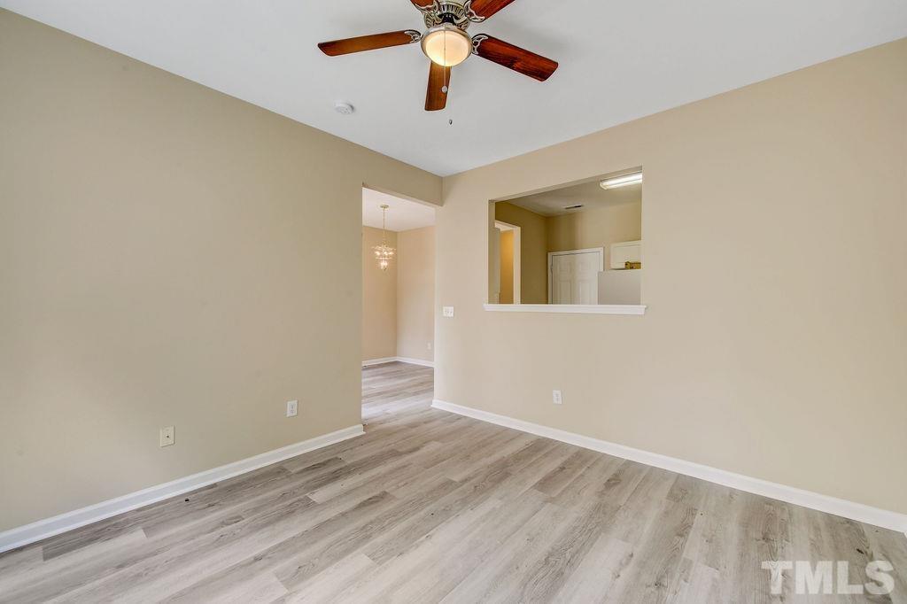 4104 Standing Rock Way Raleigh, NC 27604 - Photo 6 of 16 wooden floor in an empty room with a window