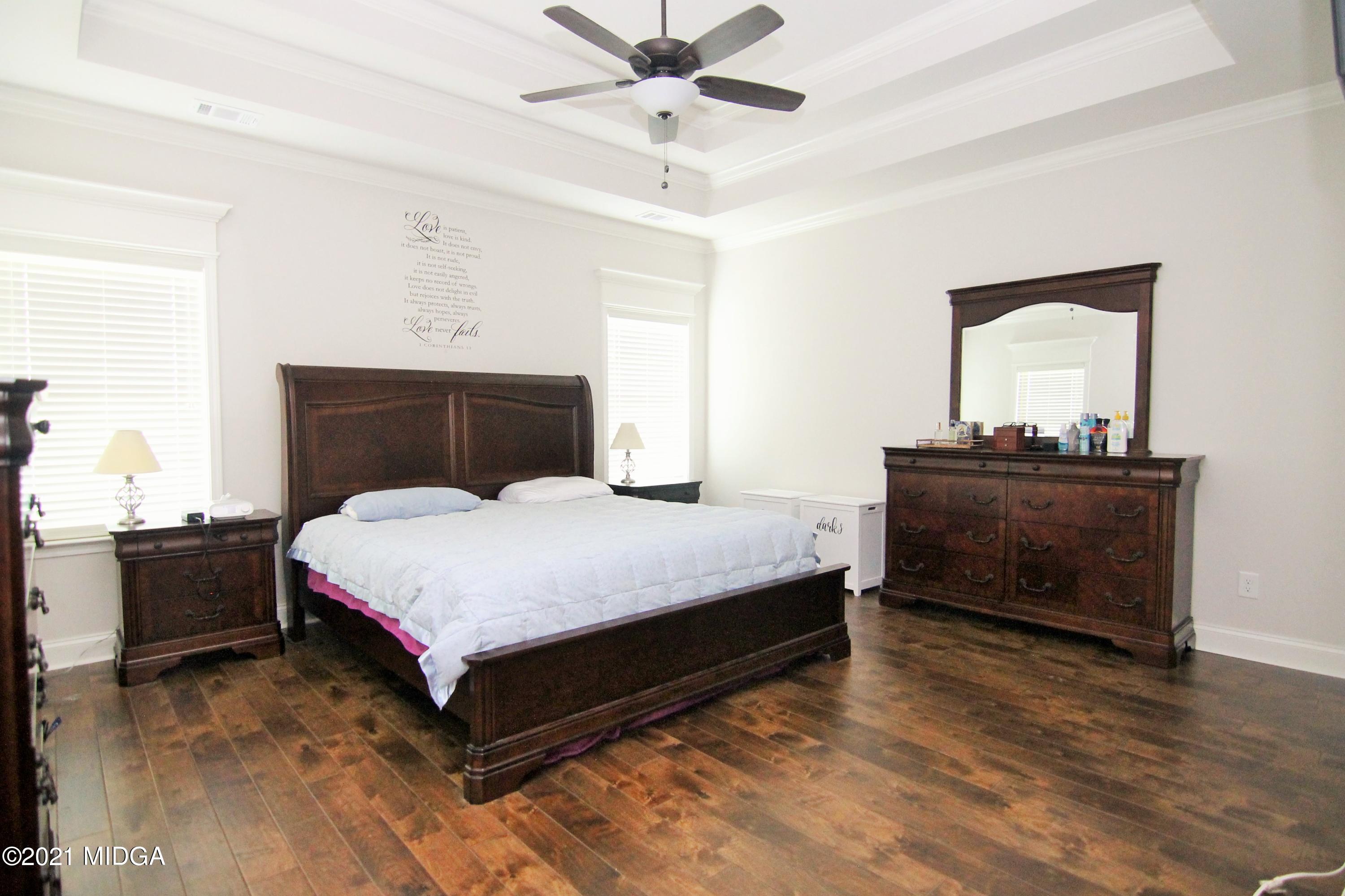 105 Timber Ridge Circle Byron, GA 31008 - Photo 13 of 28 a bedroom with a bed and window