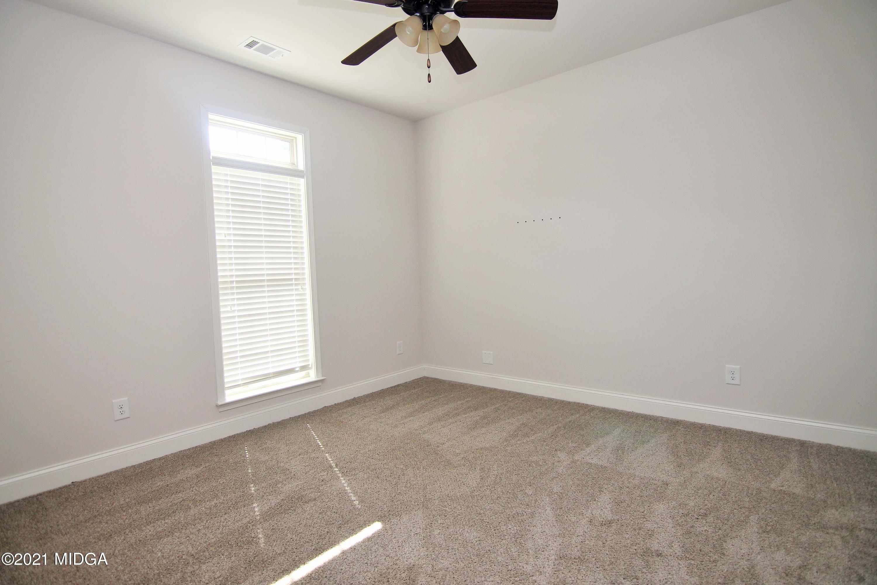 105 Timber Ridge Circle Byron, GA 31008 - Photo 19 of 28 an empty room with a window