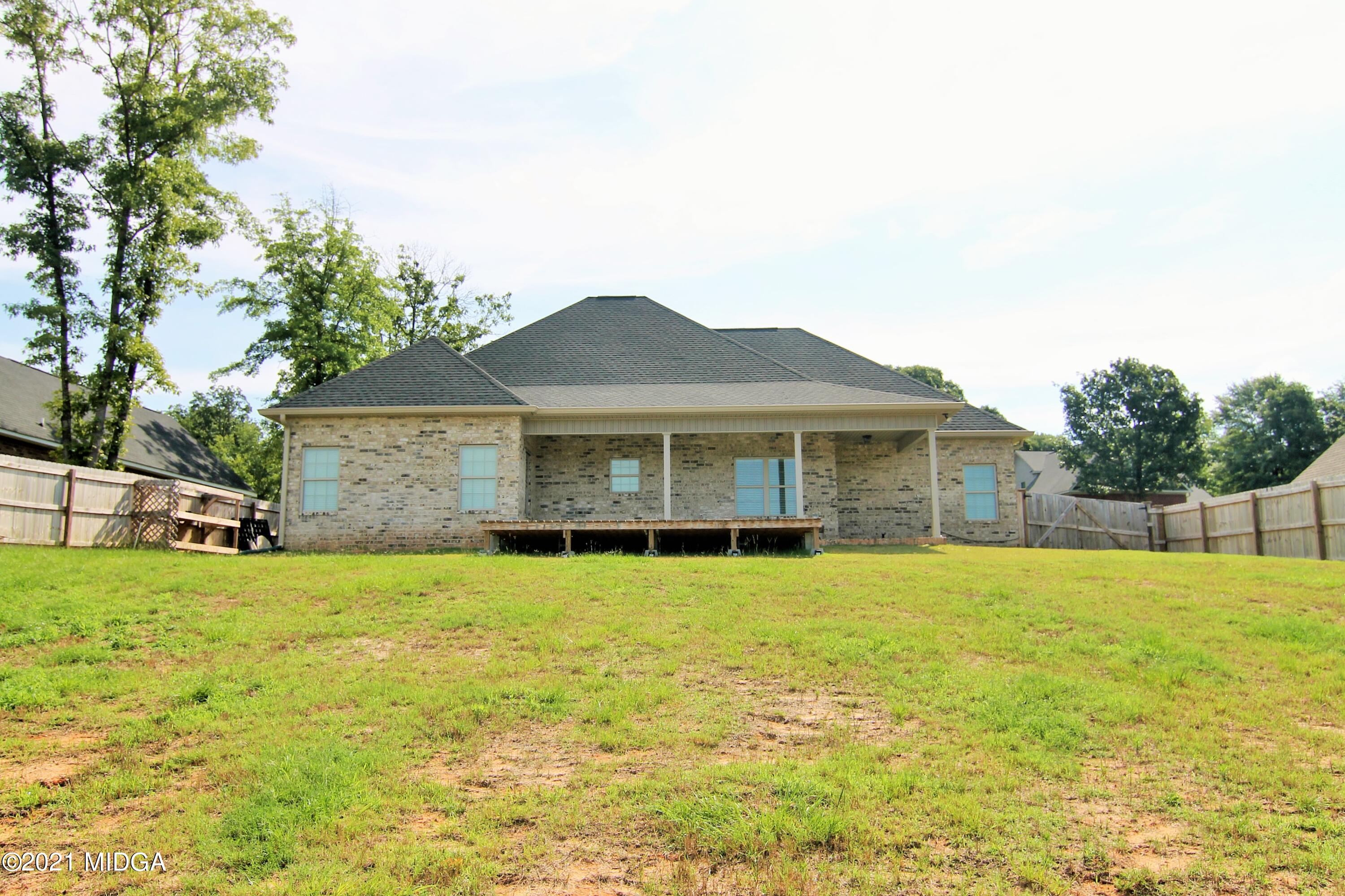 105 Timber Ridge Circle Byron, GA 31008 - Photo 27 of 28 a front view of a house with a yard and garage