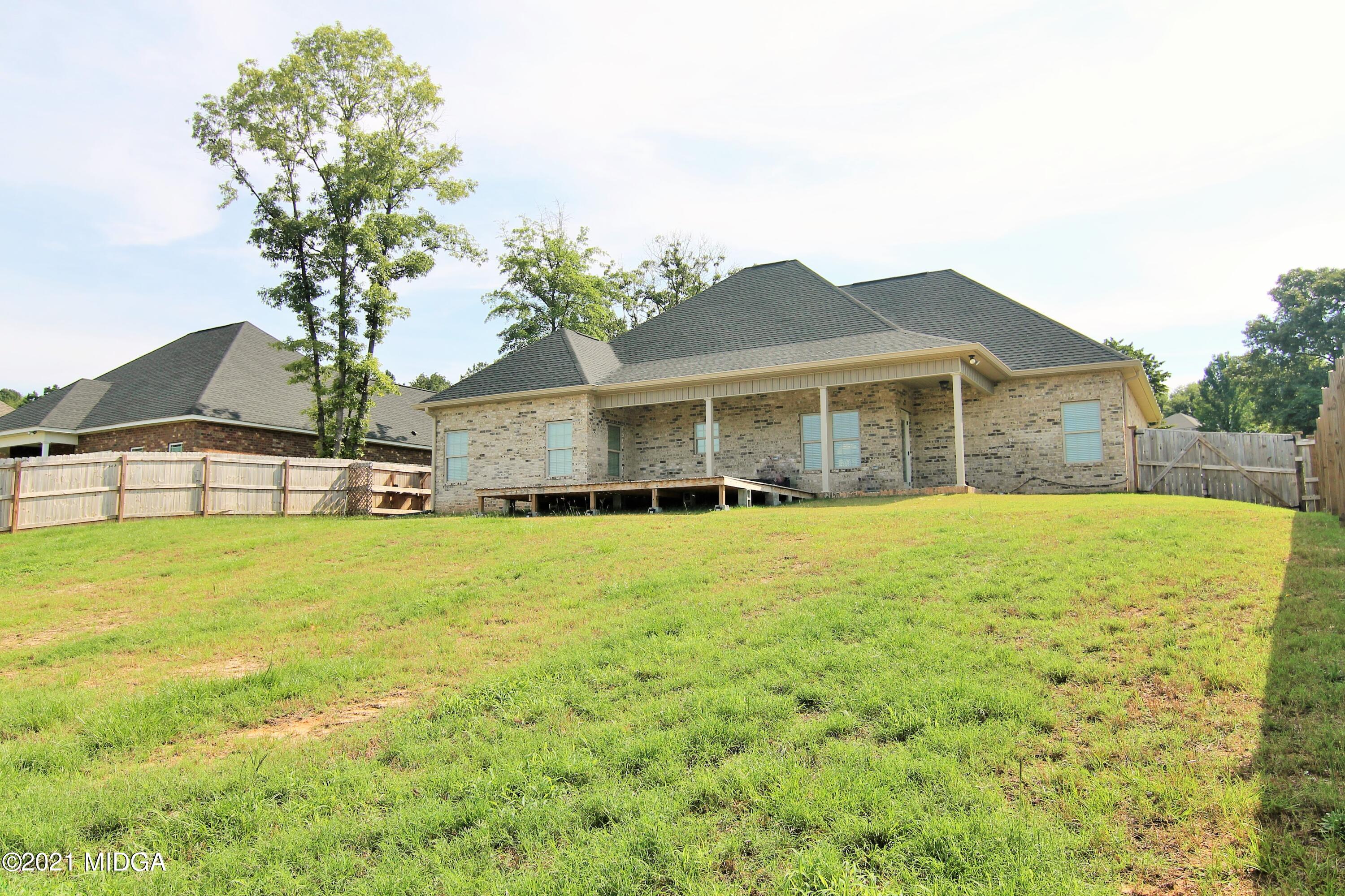 105 Timber Ridge Circle Byron, GA 31008 - Photo 28 of 28 a front view of a house with a garden