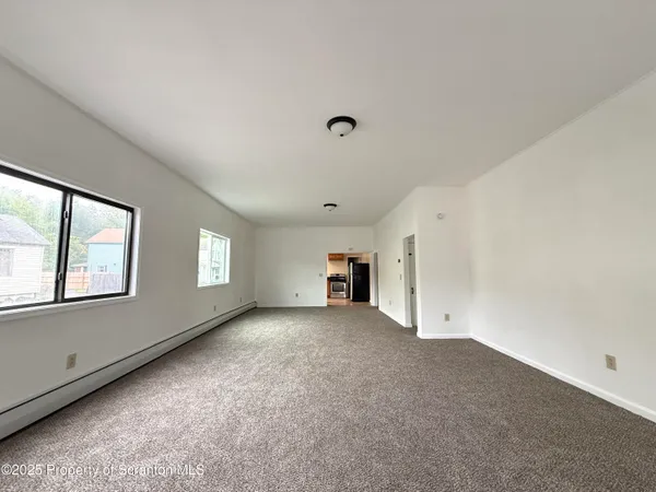 an empty room with windows