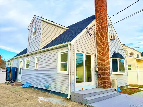 a view of a house with large windows