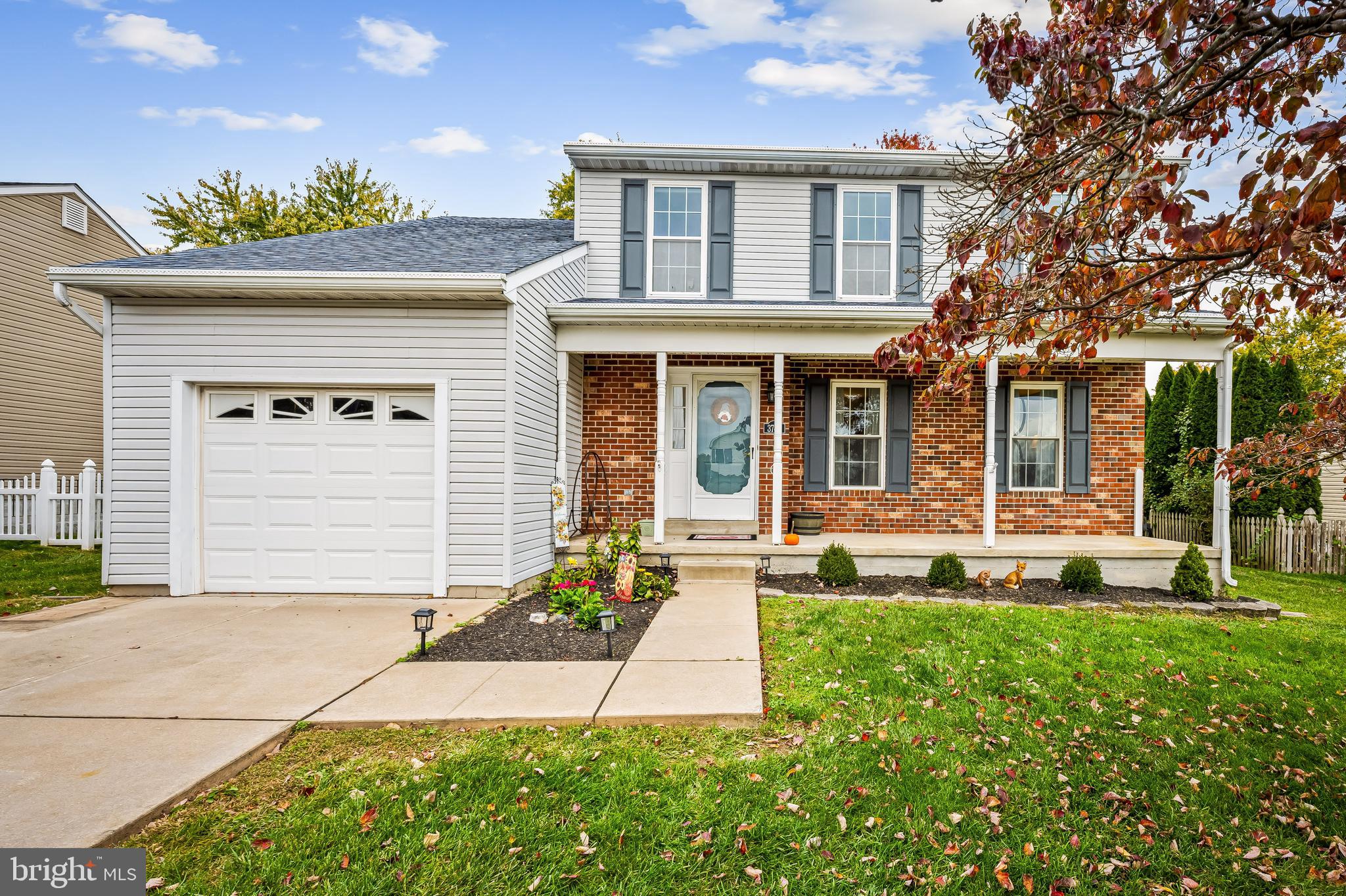 3746 Proctor Lane Nottingham, MD 21236 - Photo 1 of 36 a front view of a house with a yard and garage