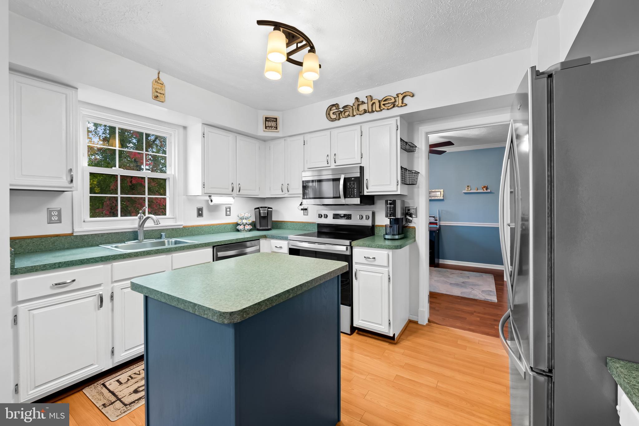 3746 Proctor Lane Nottingham, MD 21236 - Photo 12 of 36 a kitchen with a sink stove and refrigerator