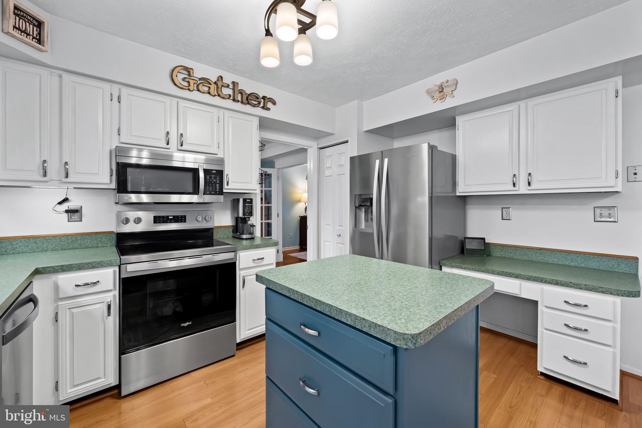 3746 Proctor Lane Nottingham, MD 21236 - Photo 13 of 36 a kitchen with a stove and a microwave
