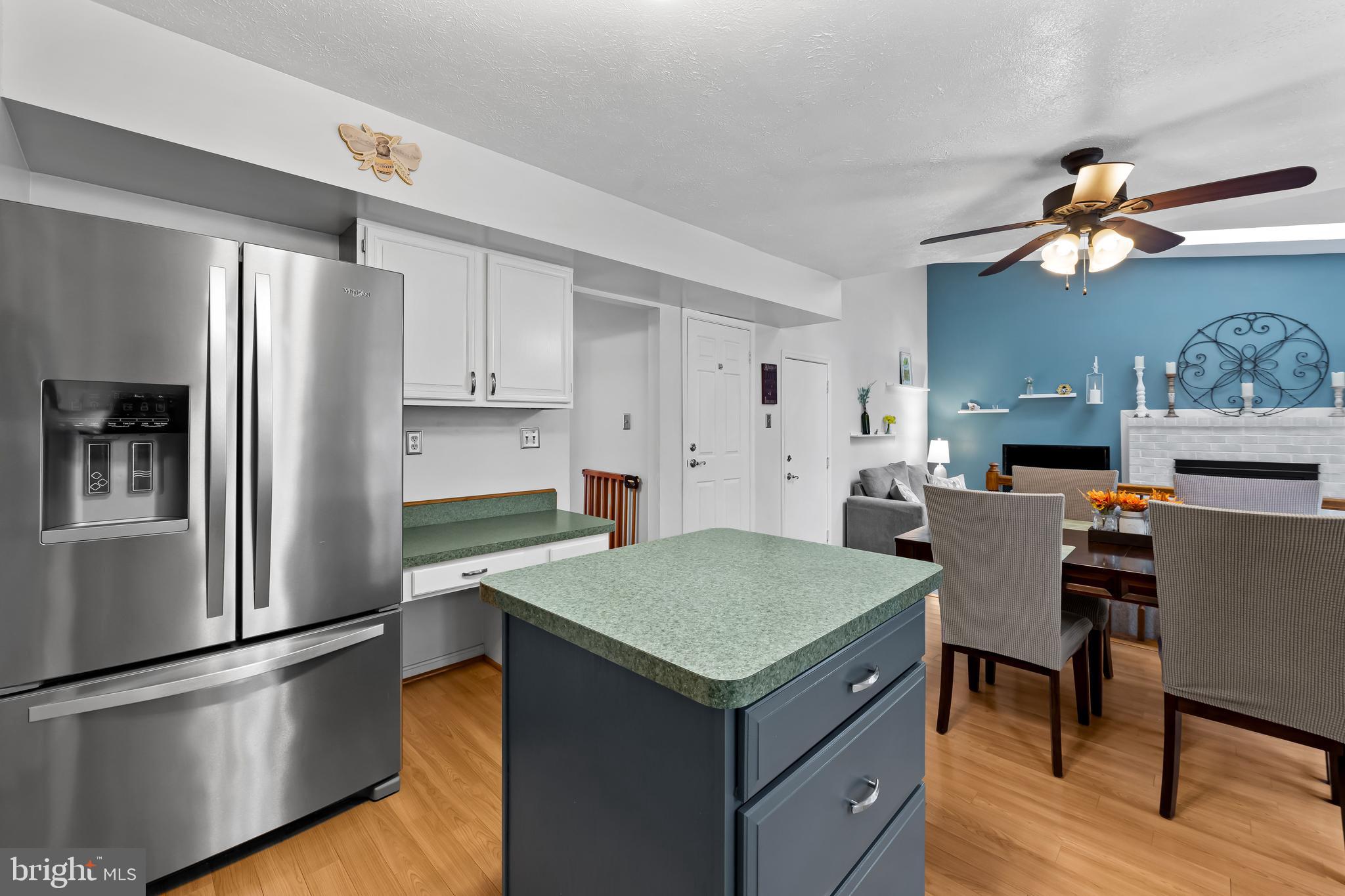 3746 Proctor Lane Nottingham, MD 21236 - Photo 14 of 36 a kitchen with kitchen island a refrigerator stove and sink
