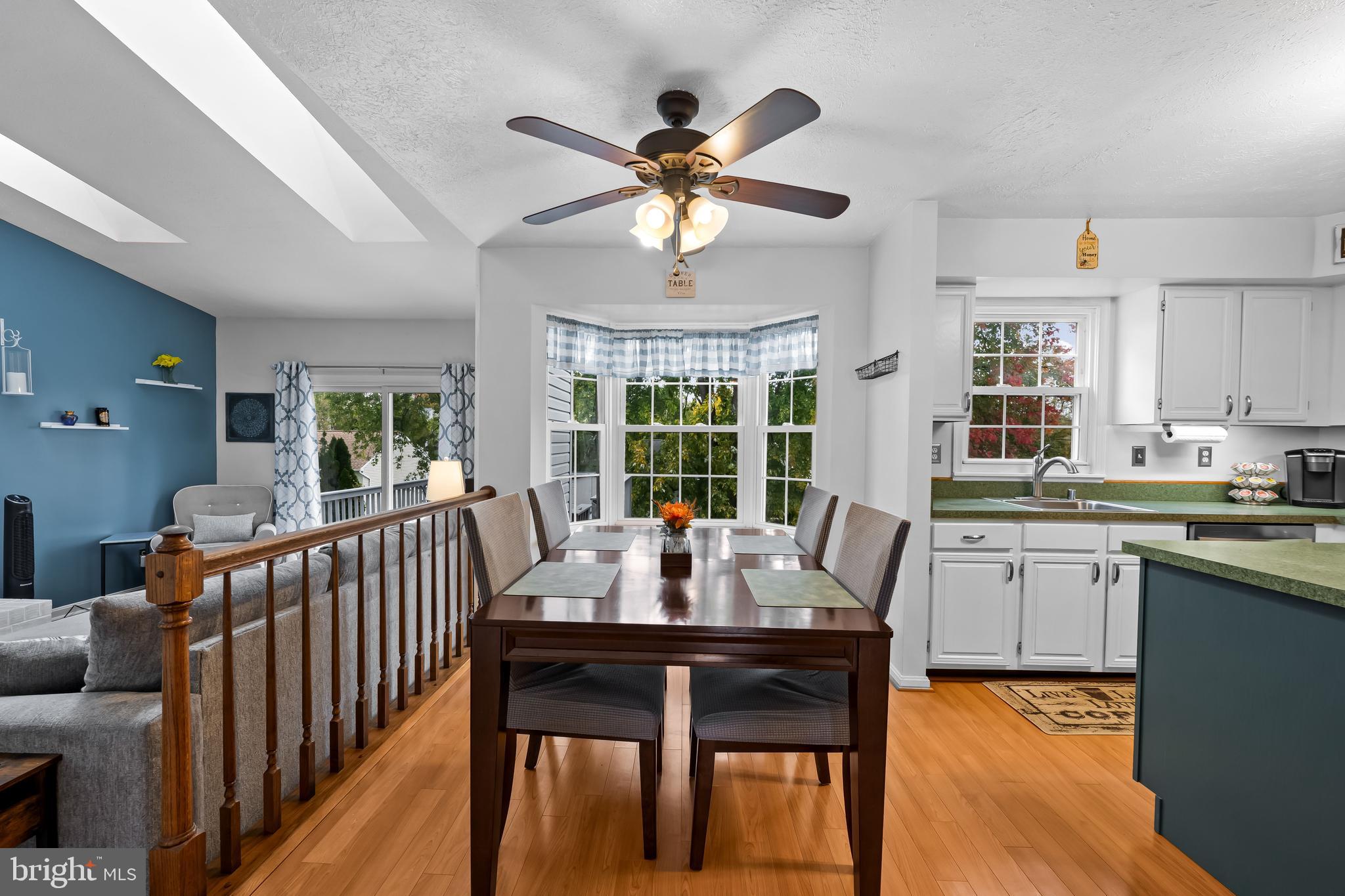 3746 Proctor Lane Nottingham, MD 21236 - Photo 17 of 36 a dining room with furniture a chandelier and wooden floor