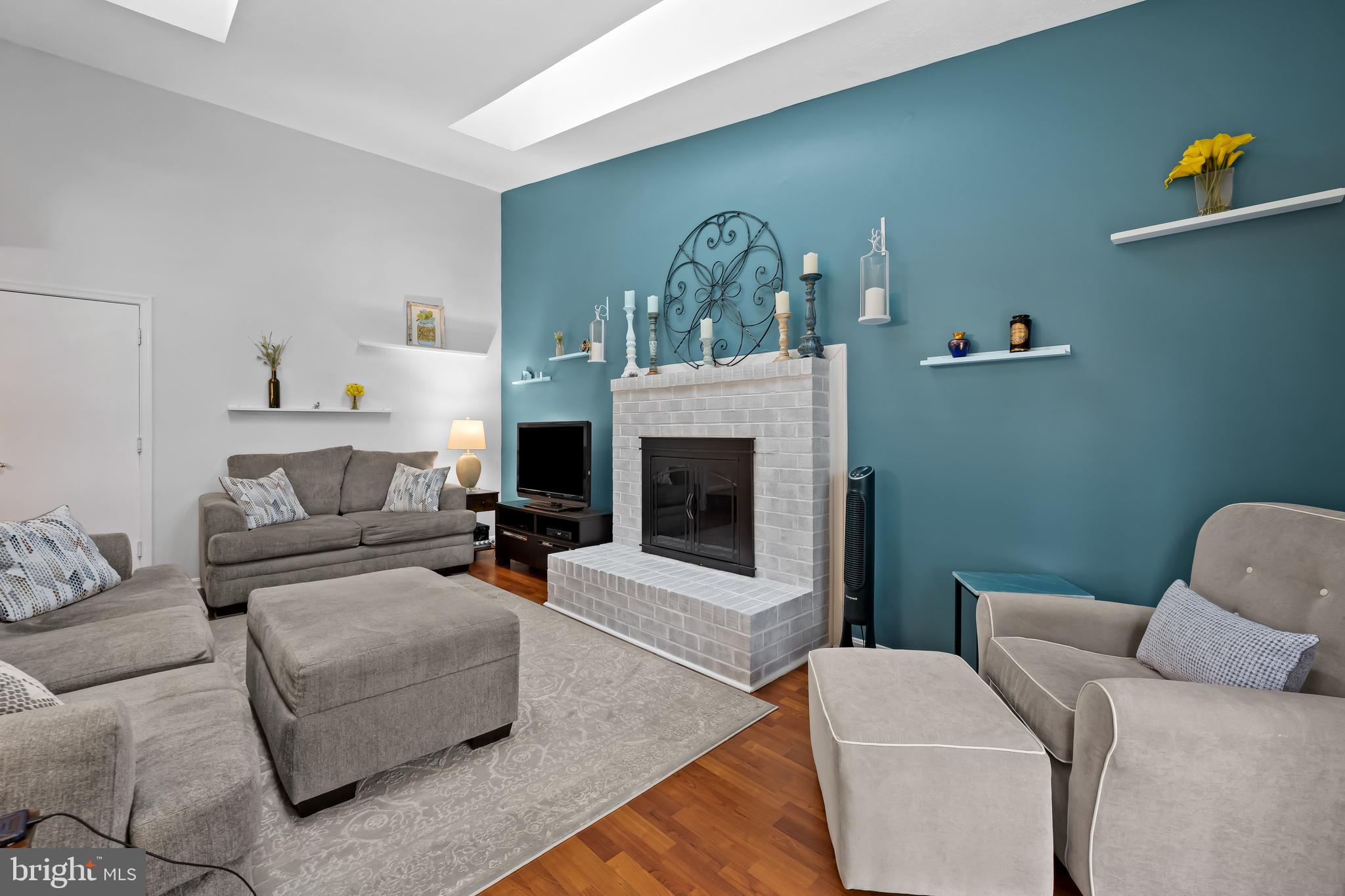 3746 Proctor Lane Nottingham, MD 21236 - Photo 20 of 36 a living room with furniture and a fireplace