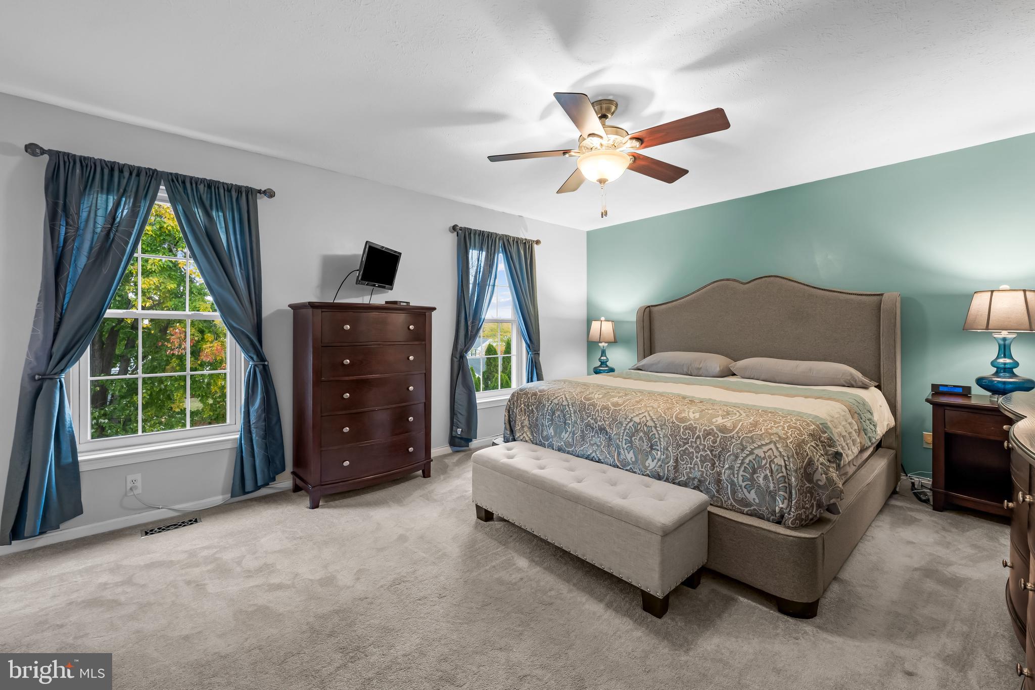 3746 Proctor Lane Nottingham, MD 21236 - Photo 22 of 36 a spacious bedroom with a bed and a chandelier