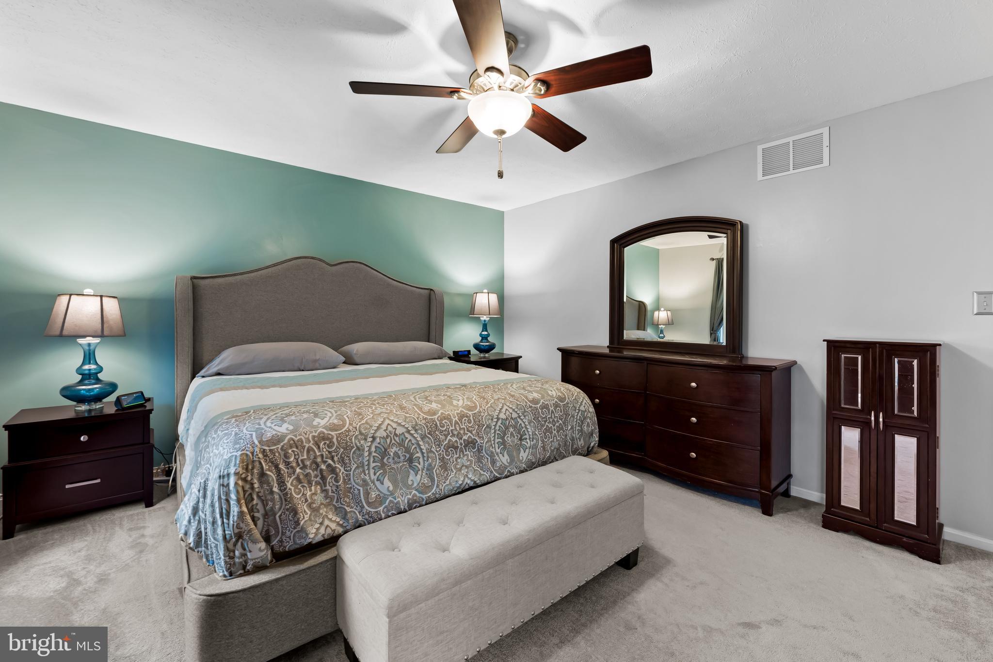 3746 Proctor Lane Nottingham, MD 21236 - Photo 23 of 36 a bedroom with a bed and a chandelier