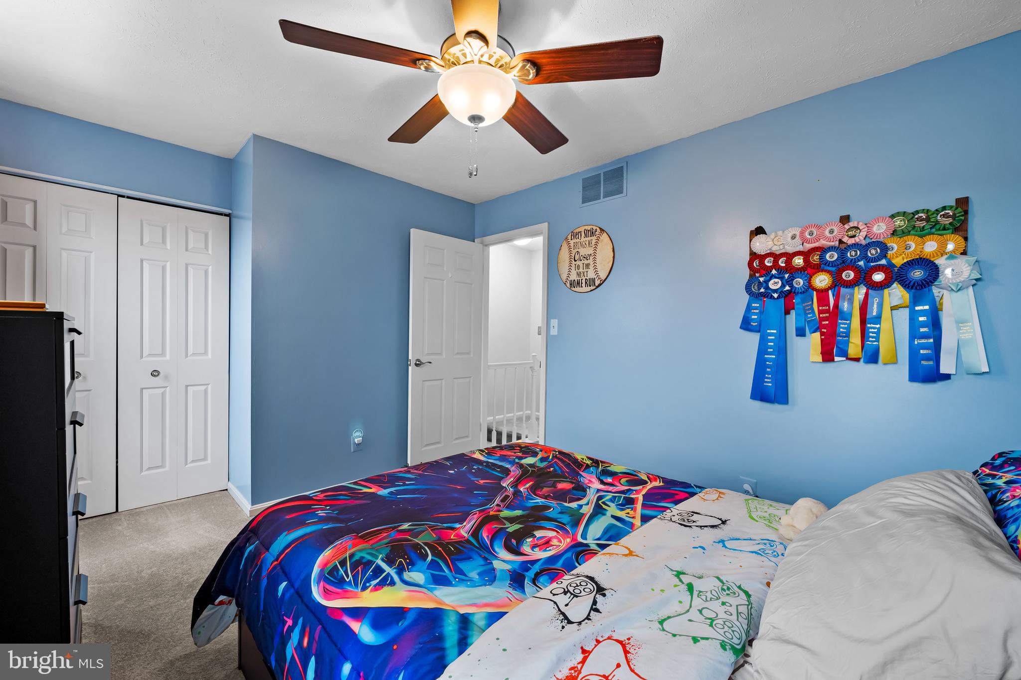 3746 Proctor Lane Nottingham, MD 21236 - Photo 27 of 36 a bedroom with a bed and a chandelier