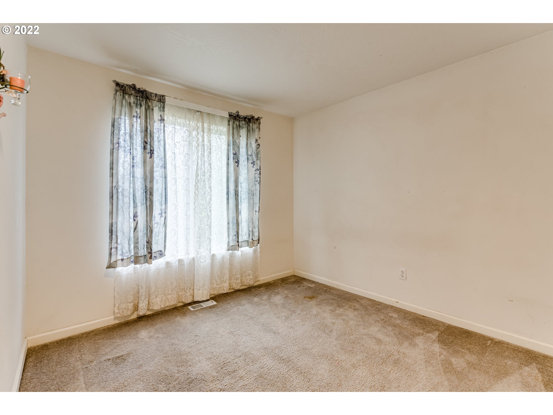 823 South 46th Street Springfield, OR 97478 - Photo 24 of 32 an empty room with wooden floor and windows