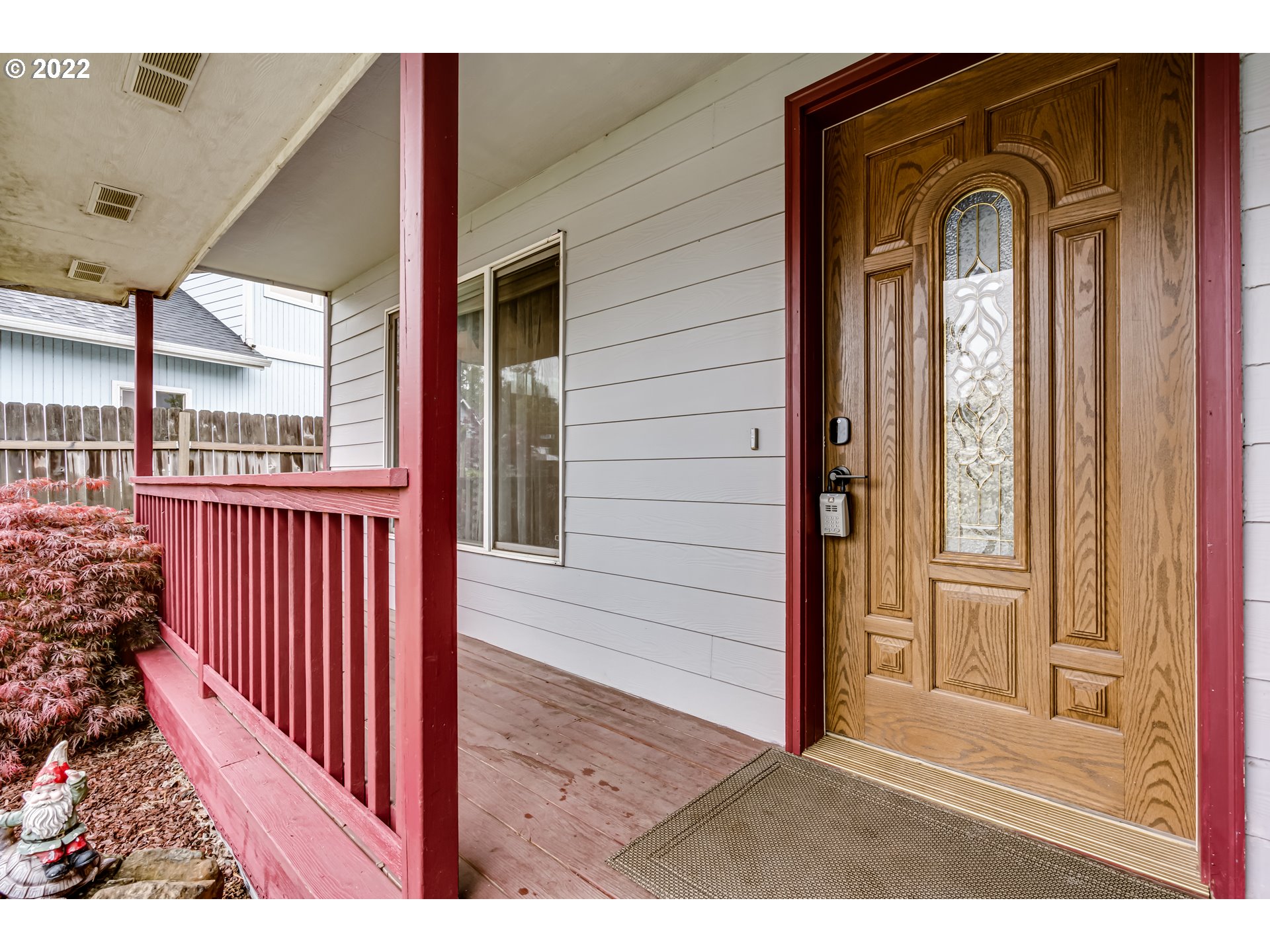 823 South 46th Street Springfield, OR 97478 - Photo 3 of 32 a view of a porch with a door and wooden floor