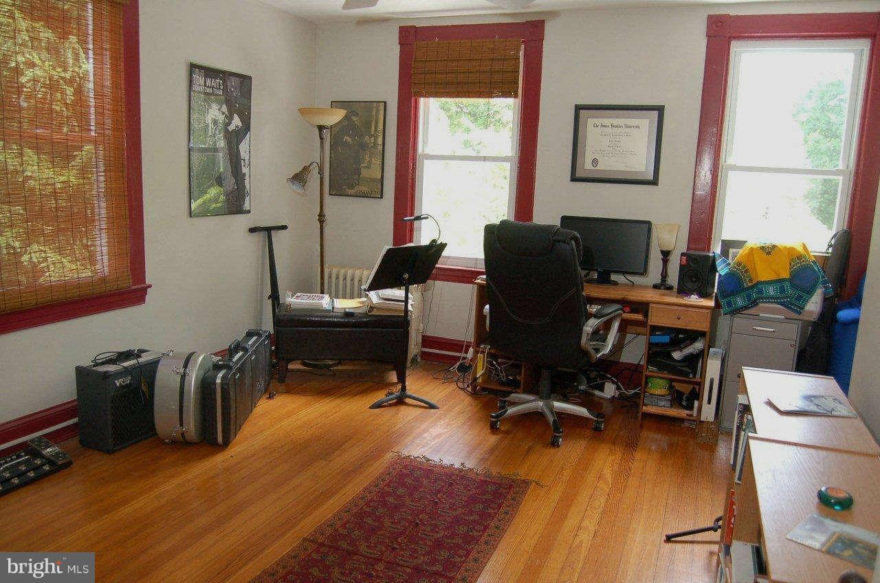 4616 Keswick Road Baltimore, MD 21210 - Photo 18 of 18 a view of a workspace with furniture and a window