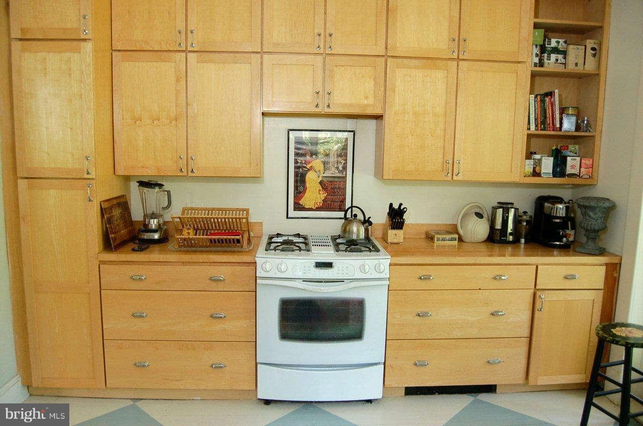 4616 Keswick Road Baltimore, MD 21210 - Photo 6 of 18 a kitchen with a stove and cabinets