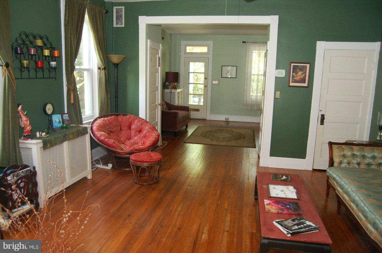 4616 Keswick Road Baltimore, MD 21210 - Photo 8 of 18 a living room with furniture and a wooden floor