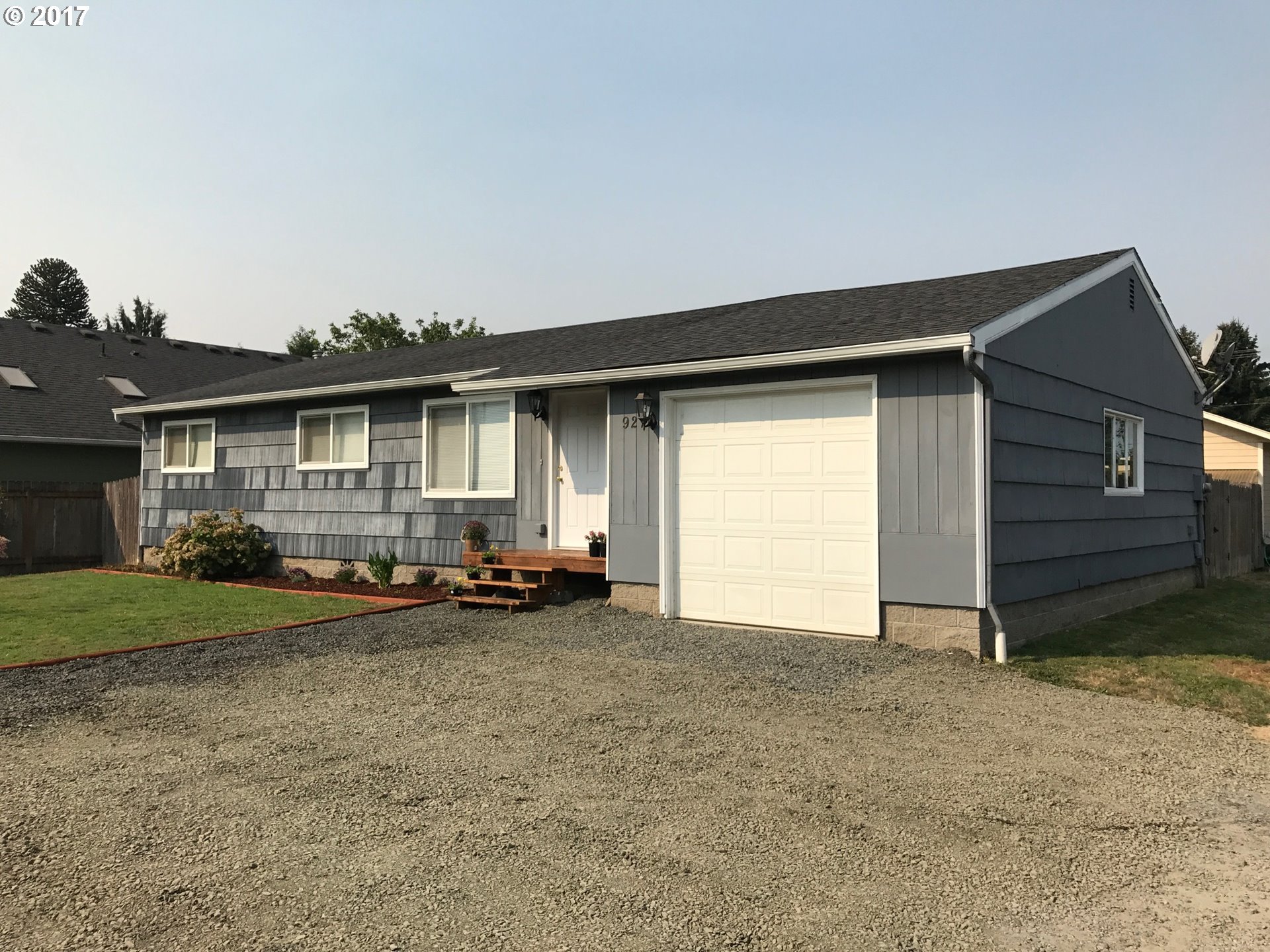 927 54th Place Springfield, OR 97478 - Photo 1 of 26 a view of a house with backyard and garden