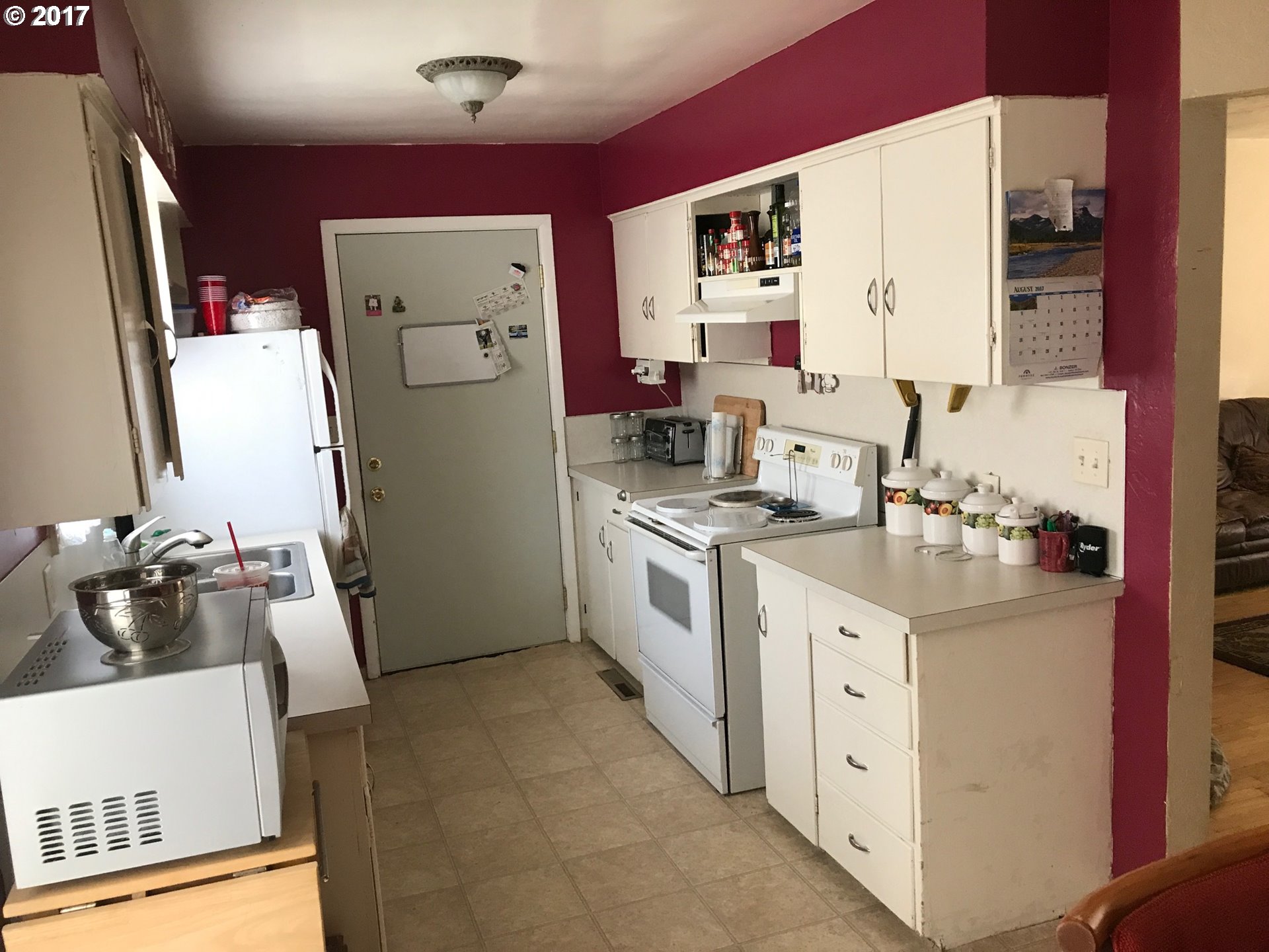 927 54th Place Springfield, OR 97478 - Photo 12 of 26 a kitchen with a sink stove and refrigerator