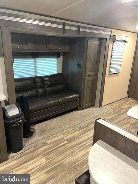 669 Route 9 Rte Cape, Unit 439 Cape May, NJ 08204 - Photo 3 of 18 a living room with a bed and a dresser