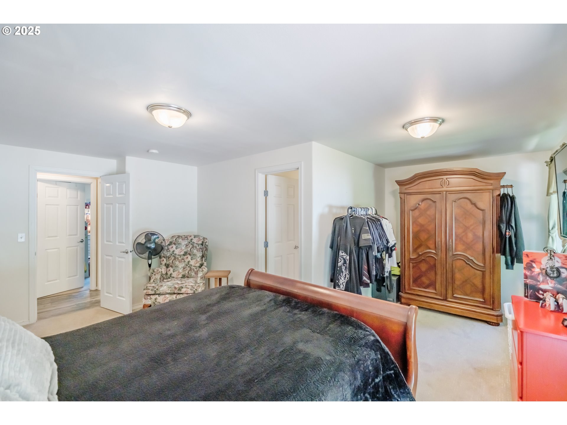 58348 Ross Road Warren, OR 97053 - Photo 16 of 27 a bed room with a bed and a chair