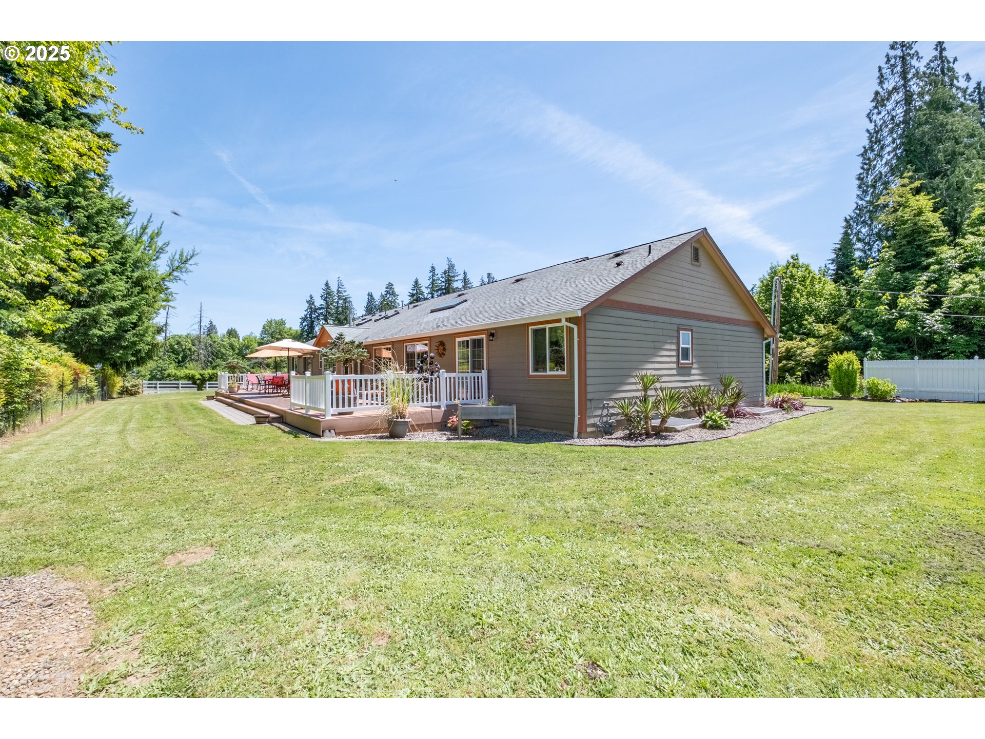 58348 Ross Road Warren, OR 97053 - Photo 23 of 27 a front view of house with yard and trees