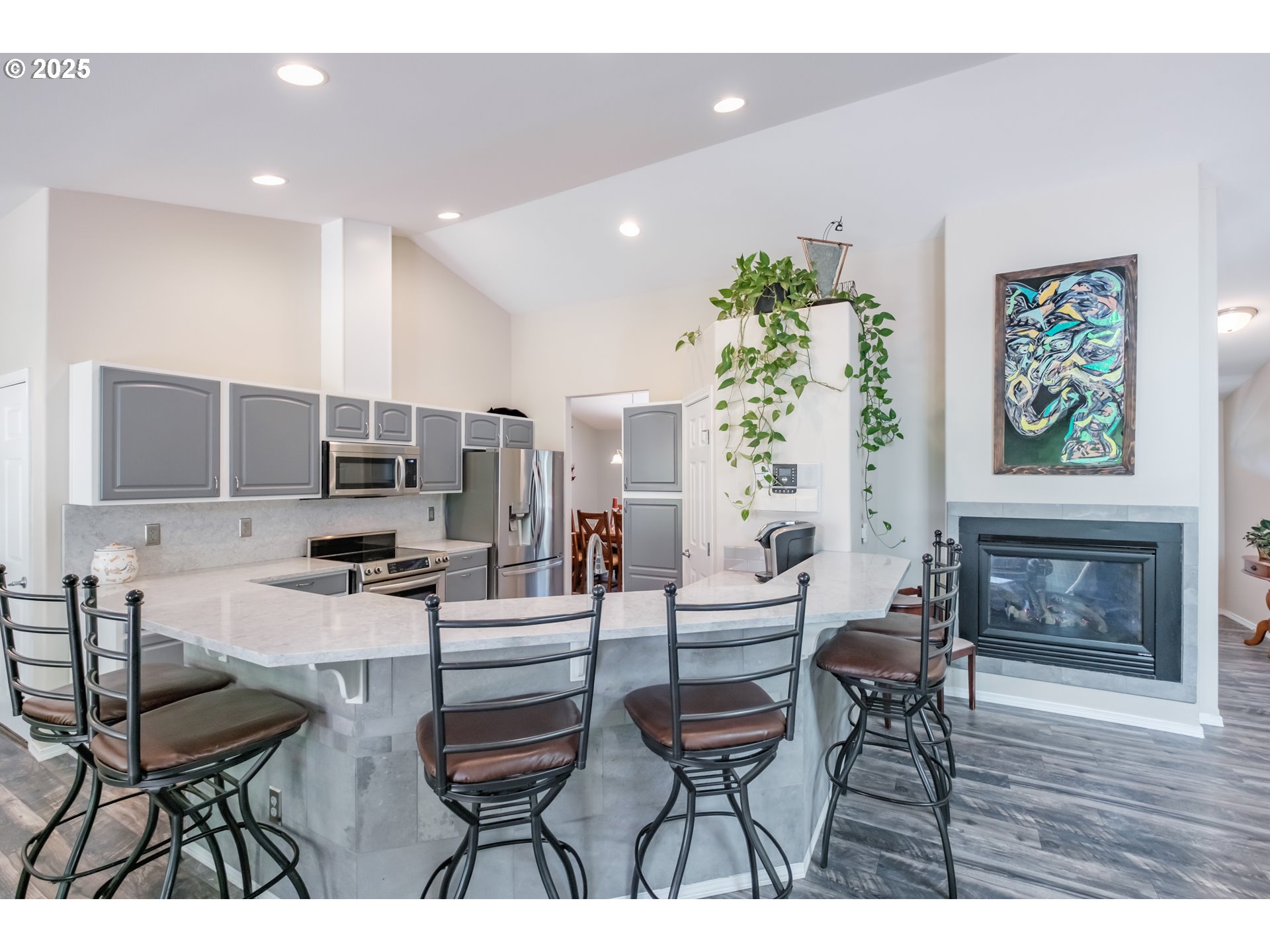 58348 Ross Road Warren, OR 97053 - Photo 9 of 27 a living room with furniture a fireplace and a flat screen tv