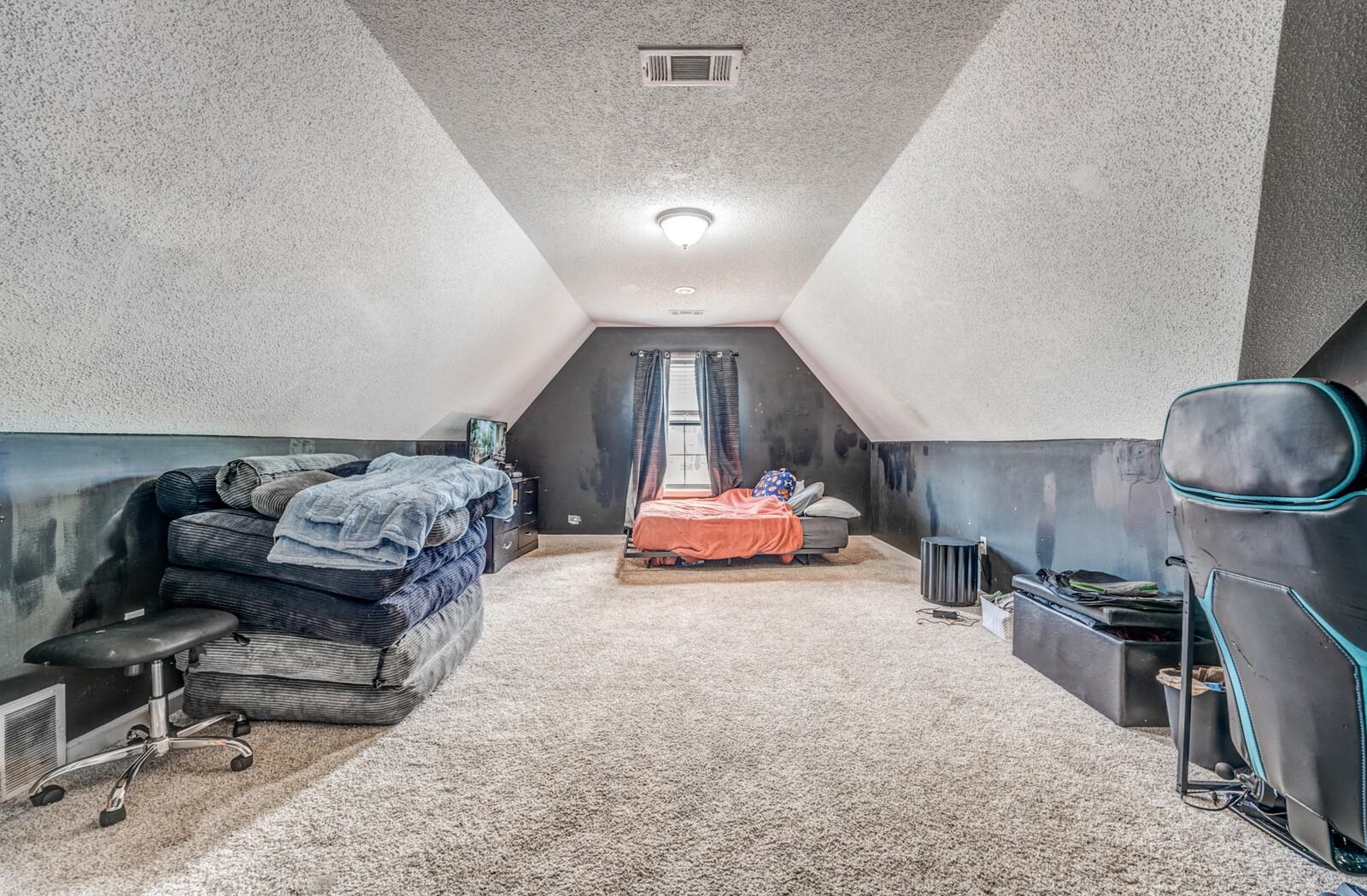 4671 Hampton Ridge Lane Bartlett, TN 38002 - Photo 30 of 40 Carpeted bonus room with sloped ceilings and a window