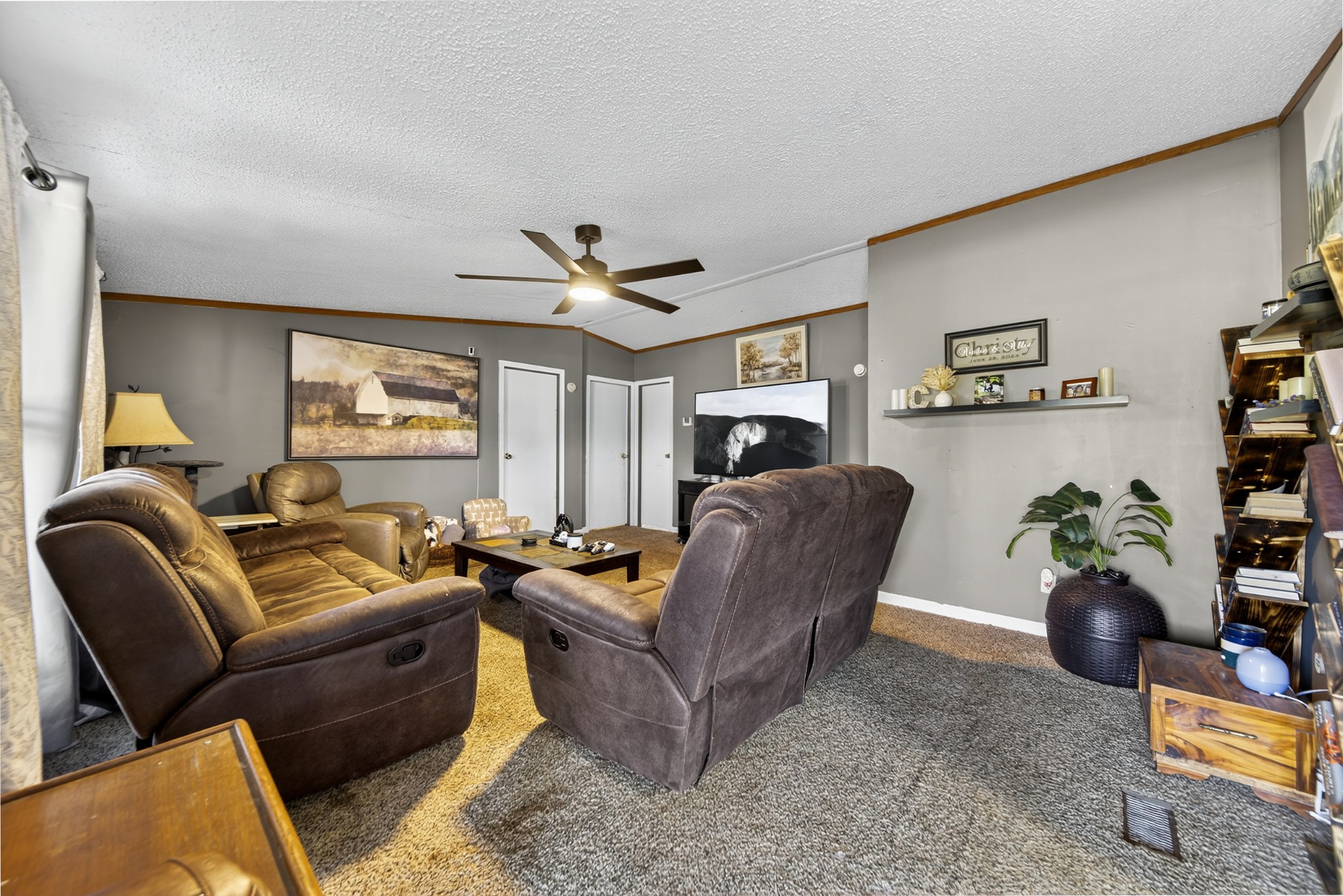 634 Pointe Lane Lafayette, TN 37083 - Photo 15 of 51 a living room with furniture and a flat screen tv
