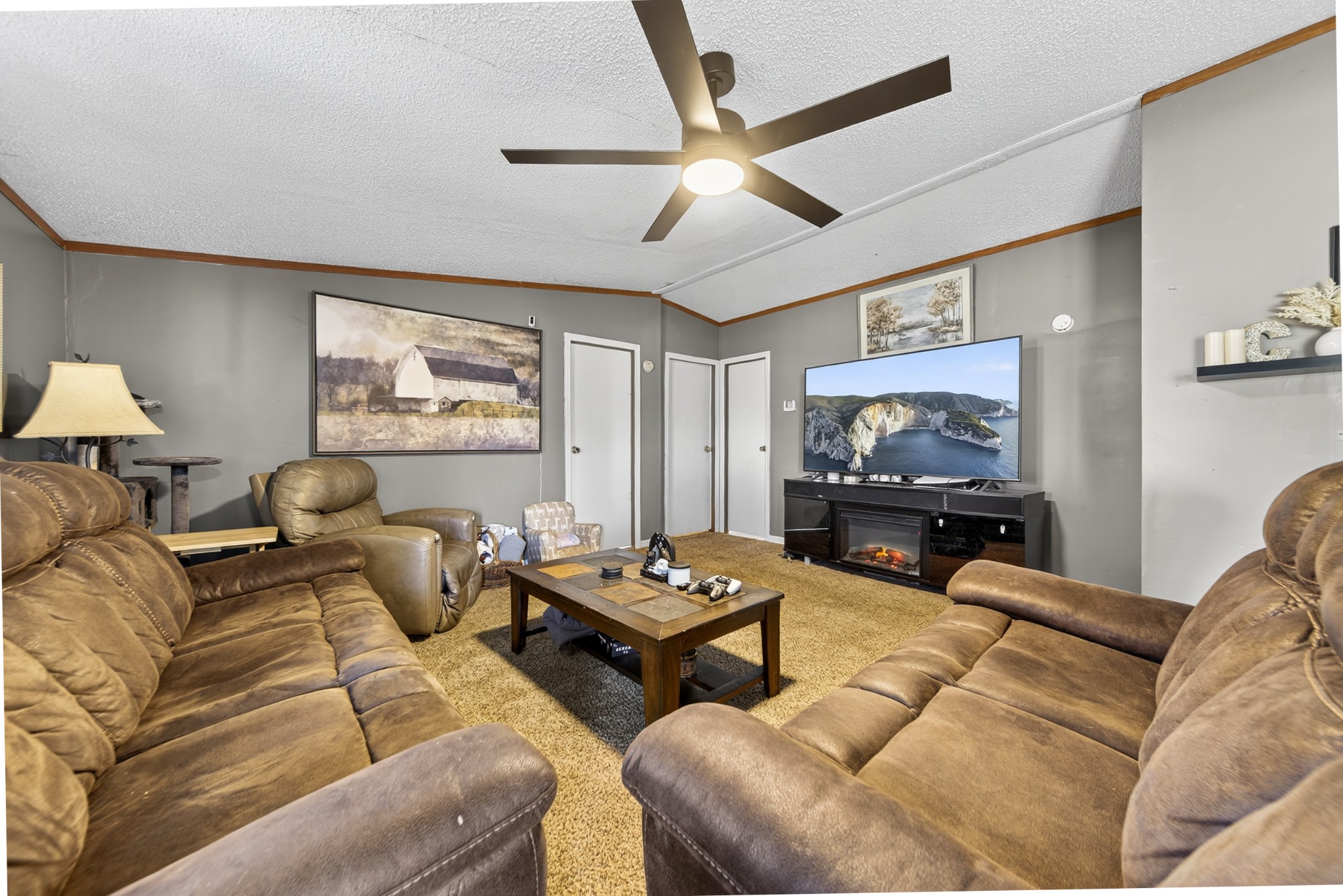 634 Pointe Lane Lafayette, TN 37083 - Photo 17 of 51 a living room with furniture and a flat screen tv