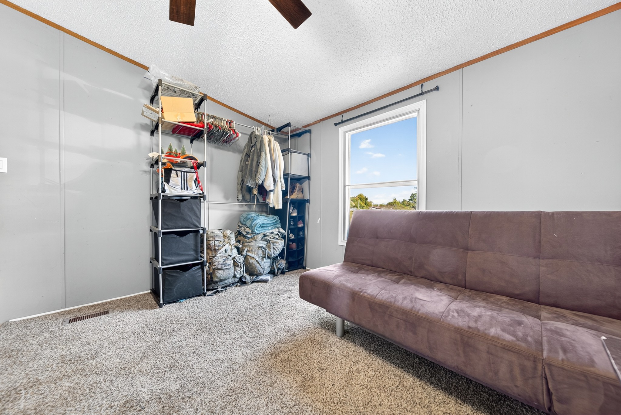 634 Pointe Lane Lafayette, TN 37083 - Photo 20 of 51 a living room with a couch and a window