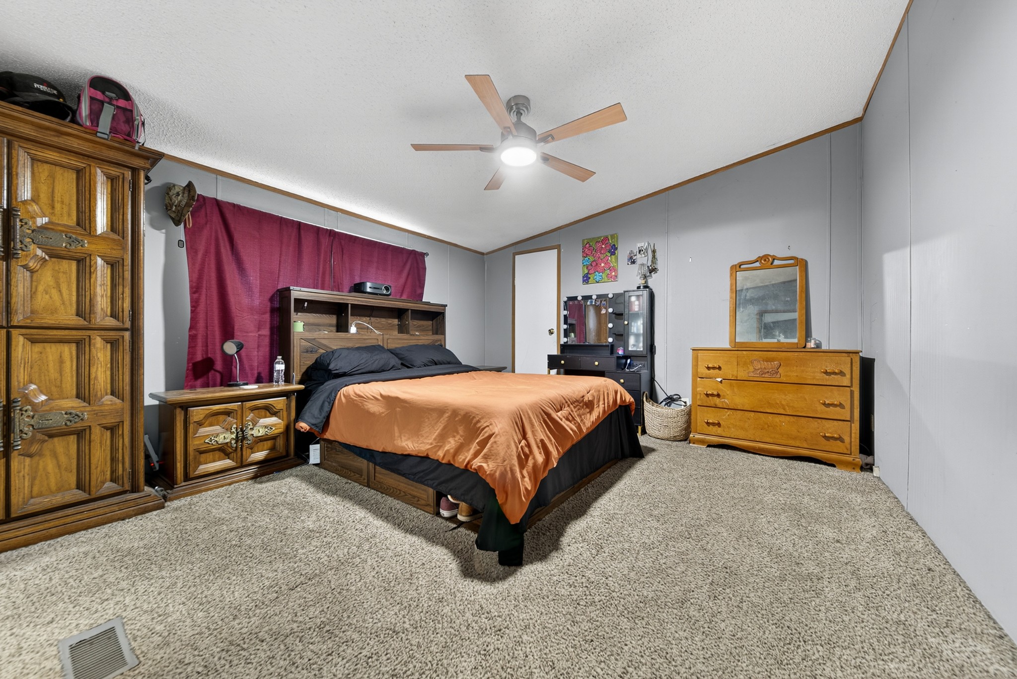634 Pointe Lane Lafayette, TN 37083 - Photo 24 of 51 a bed sitting in a room with a tv and dresser