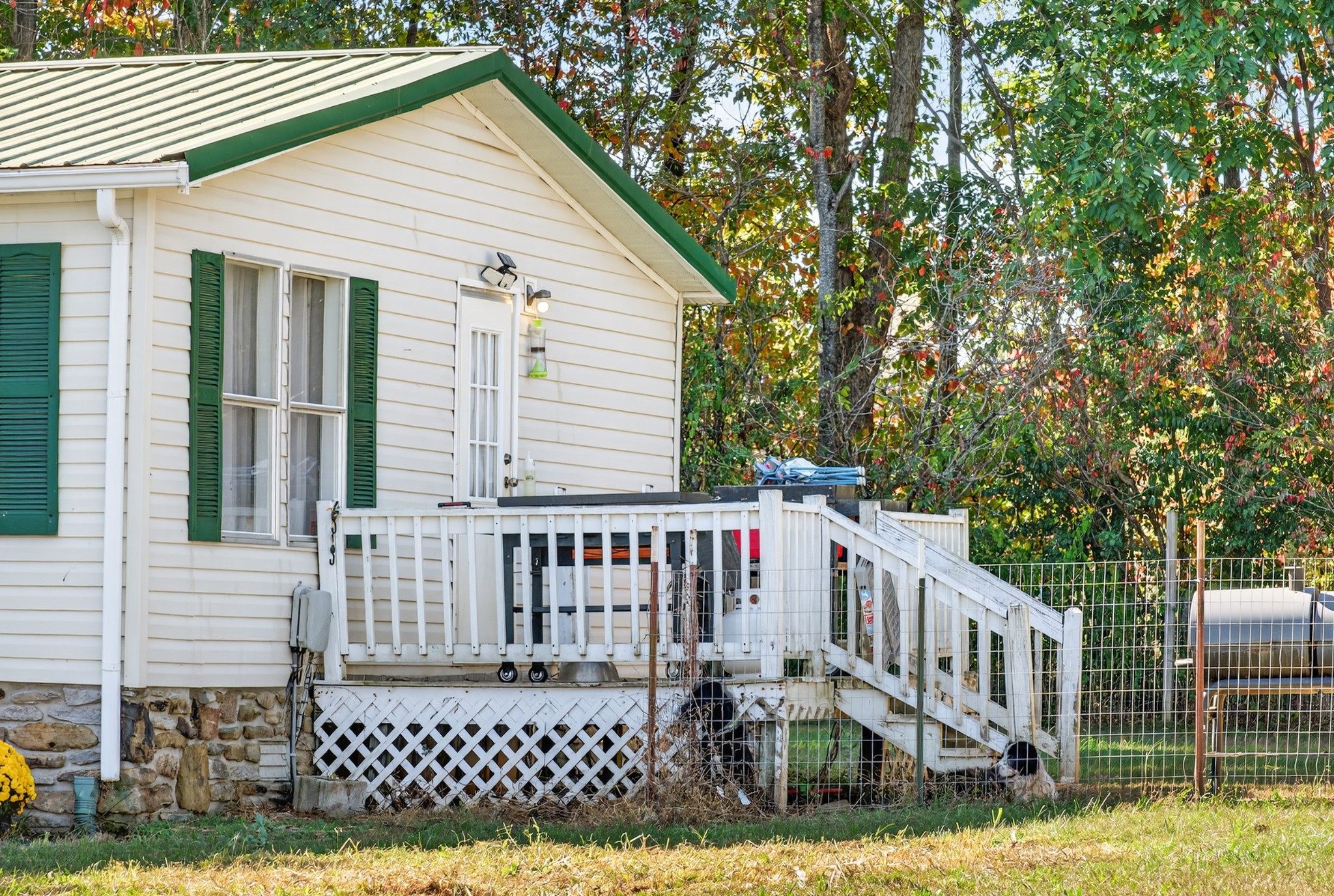 634 Pointe Lane Lafayette, TN 37083 - Photo 31 of 51 a view of a wooden house with a small yard