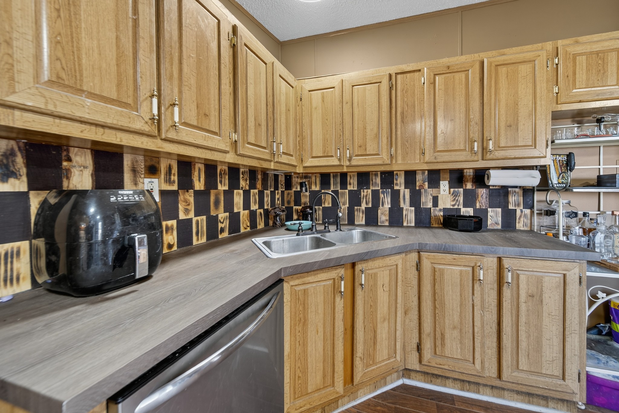 634 Pointe Lane Lafayette, TN 37083 - Photo 47 of 51 a kitchen with stainless steel appliances granite countertop a refrigerator a sink and white cabinets