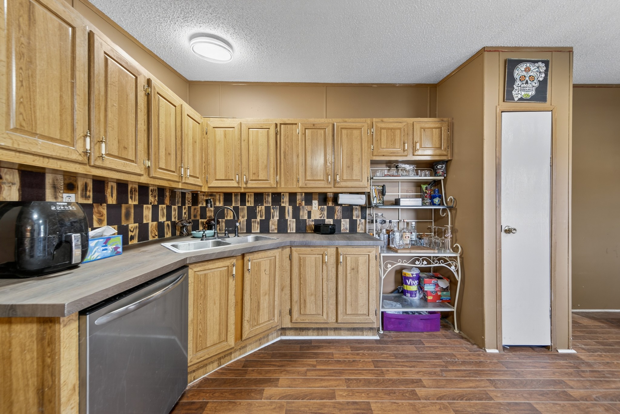 634 Pointe Lane Lafayette, TN 37083 - Photo 48 of 51 a kitchen with stainless steel appliances granite countertop a refrigerator and cabinets