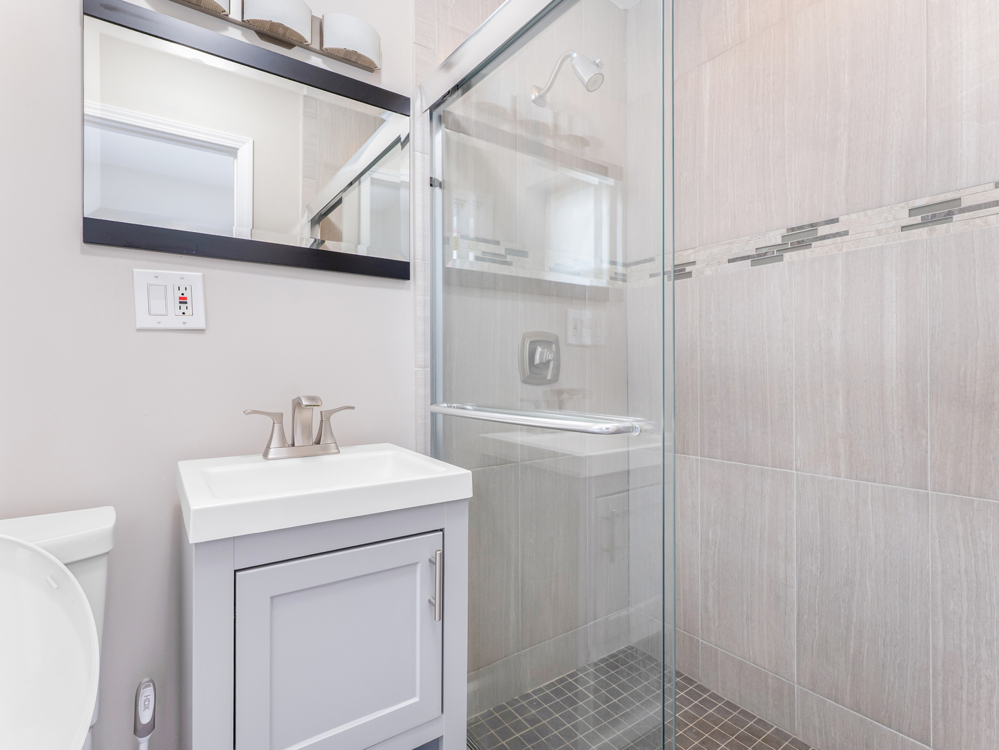 3439 West 66th Place Chicago, IL 60629 - Photo 16 of 31 a bathroom with a sink a toilet and vanity